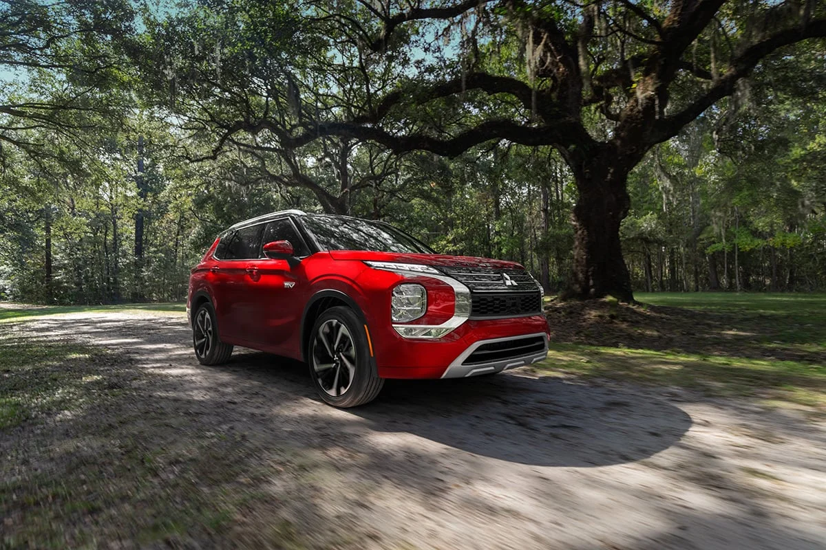 Red Mitsubishi Outlander Plug-in Hybrid low angle side profile