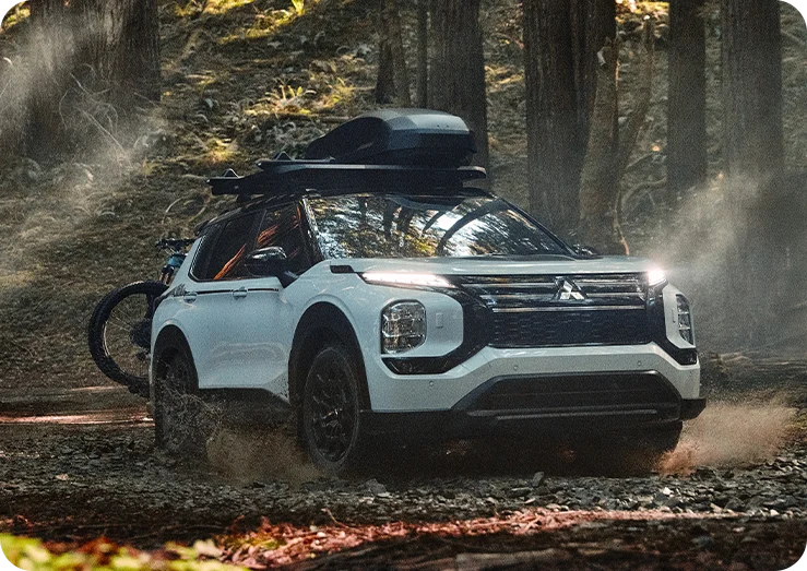 Mitsubishi Outlander adventuring through the forest